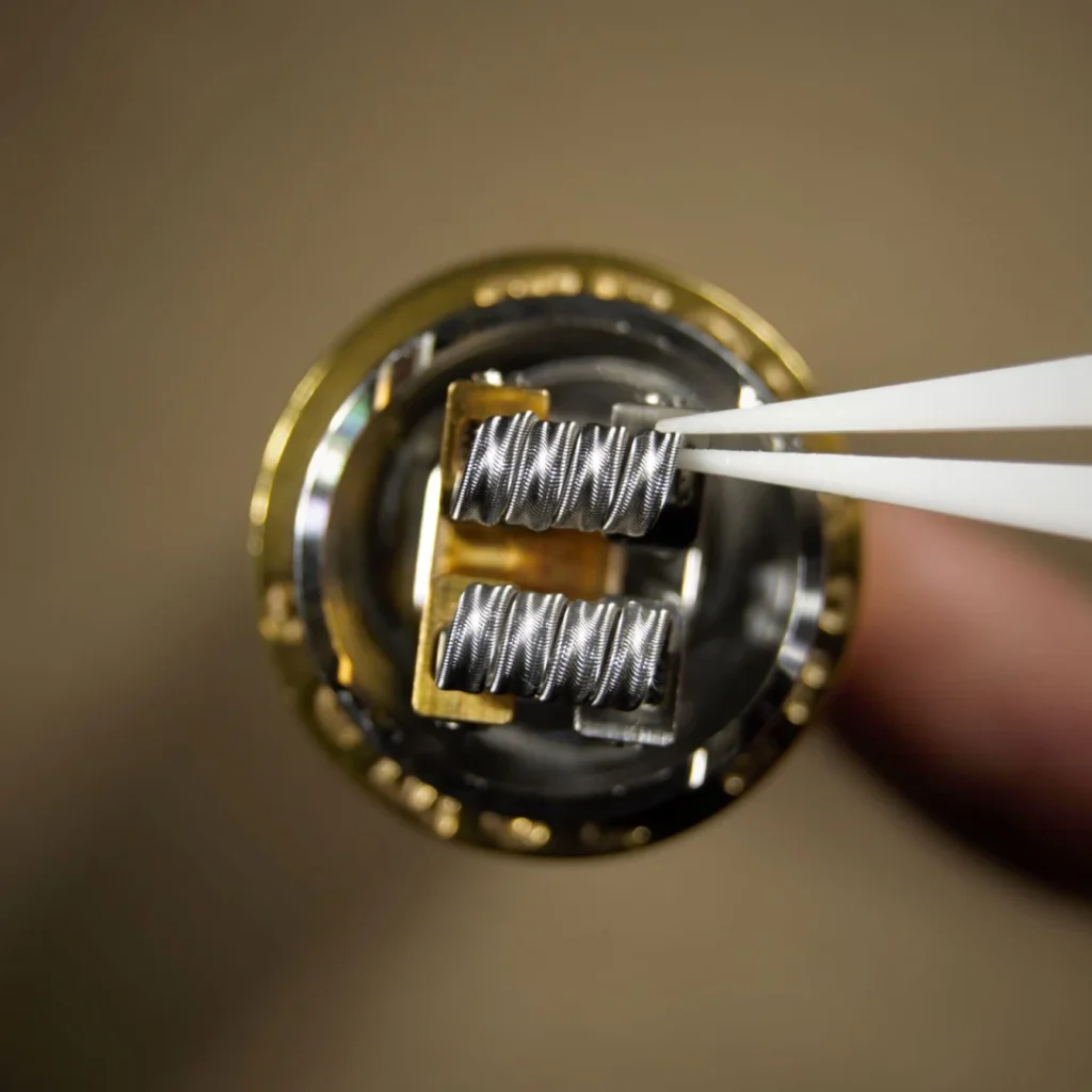 Stretching the coil before the dry burn with tweezers